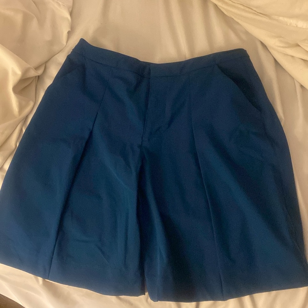 Blue pleaded Lululemon shorts.